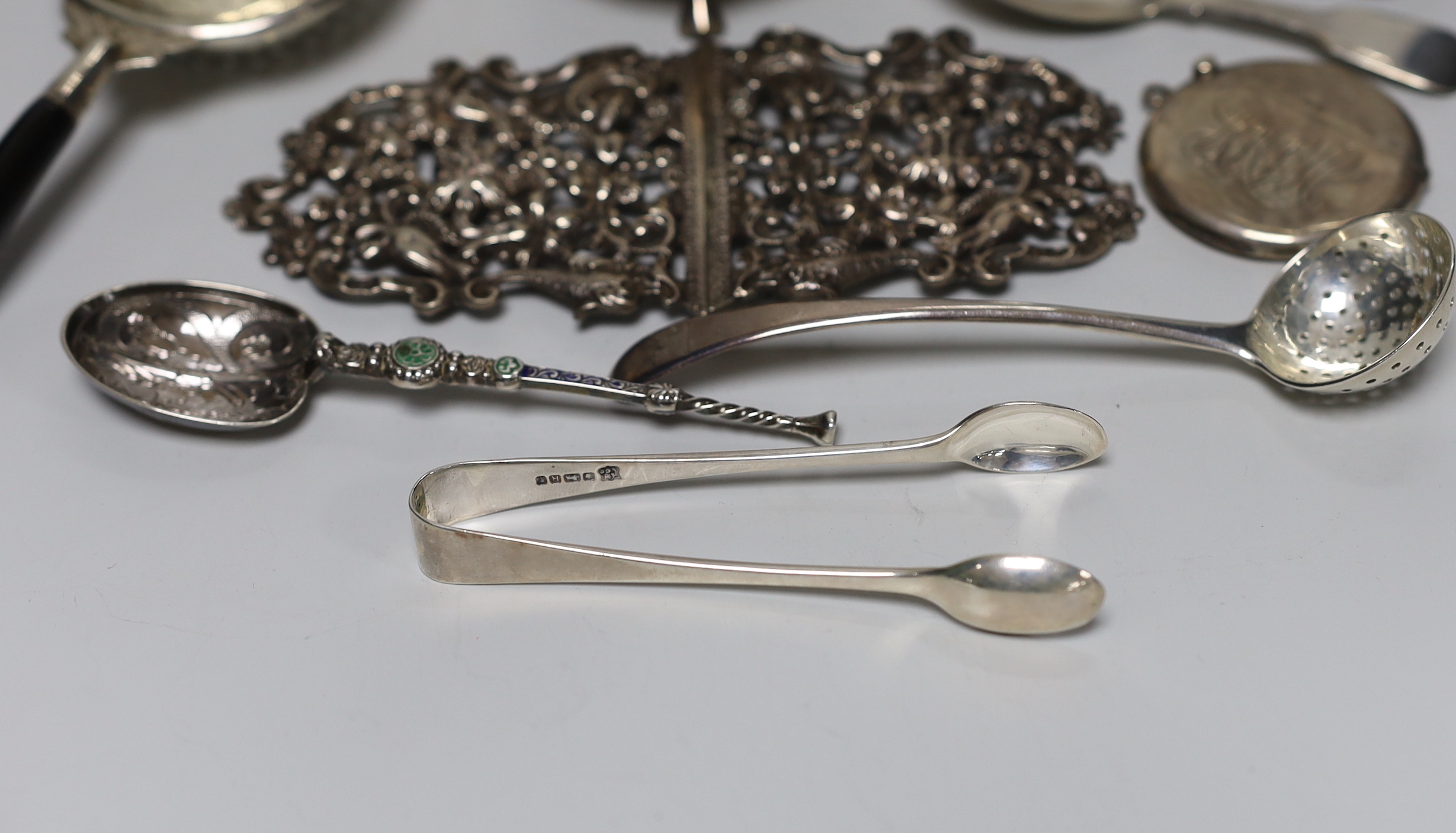 Sundry silver and white metal items including vesta cases, William IV caddy spoon, belt buckle, enamelled replica of the anointing spoon, etc.